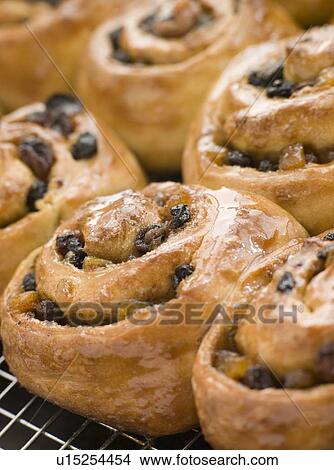 Picture - Chelsea Buns on a cooling rack. Fotosearch