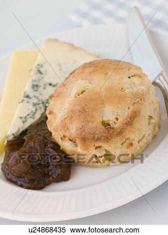 Stock Photography - Cinnamon and Apple Scone with Stilton Cheddar and Chutney. Fotosearch