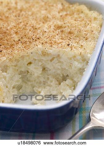 Stock Photograph - Dish of Creamed Rice Pudding with Nutmeg. Fotosearch