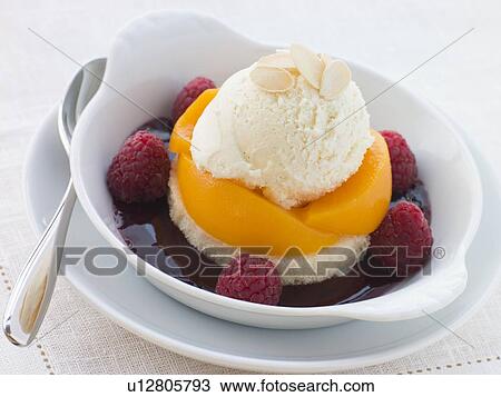 Stock Image - Dish of Peach Melba. Fotosearch