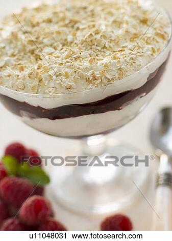 Stock Image - Glass of Raspberry Cranachan. Fotosearch
