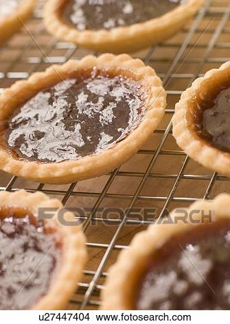 Picture - Jam Tarts on a cooling rack. Fotosearch