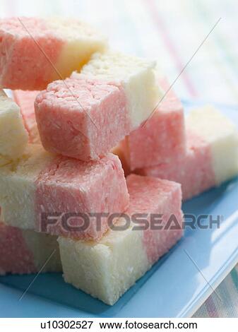 Stock Photo - Plate of Coconut Ice Sweets. Fotosearch