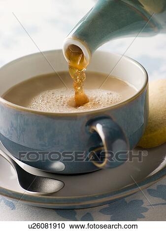 Pouring a Cup of Tea View Large Photo Image Stock Image - Pouring a Cup of Tea. Fotosearch