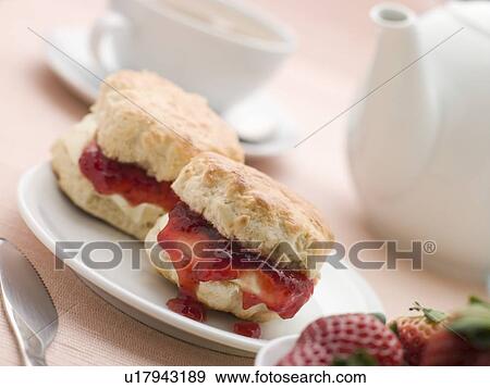 Scones Jam Clotted Cream and Strawberries with Afternoon Tea View Large Photo Image Stock Photo - Scones Jam Clotted Cream and Strawberries with Afternoon Tea. Fotosearch