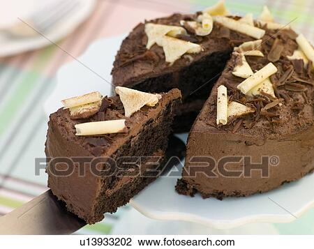 Stock Image - Slice of Chocolate Victoria Sponge. Fotosearch