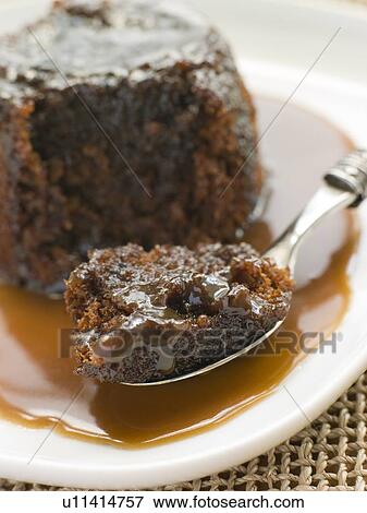 Stock Photo - Sticky Toffee Pudding with Toffee Sauce. Fotosearch