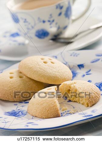 Stock Photography - Wellington Button Biscuits with a Cup of Tea. Fotosearch