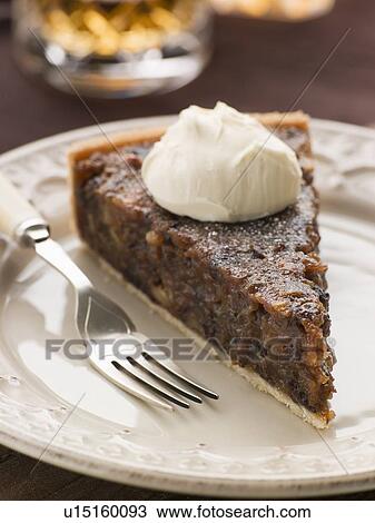 Whiskey and Dried Fruit Tart with Whipped Cream View Large Photo Image Stock Image - Whiskey and Dried Fruit Tart with Whipped Cream. Fotosearch