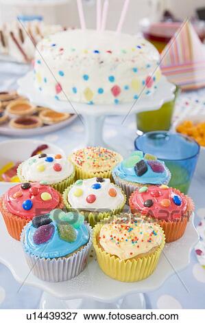 Stock Photo - Birthday party table setting with food. Fotosearch
