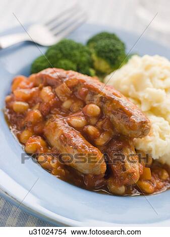 Sausage and Baked Bean Casserole with Mashed Potato and Broccoli View Large Photo Image Picture - Sausage and Baked Bean Casserole with Mashed Potato and Broccoli. Fotosearch