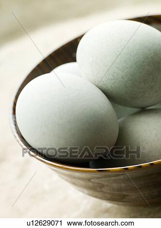 Stock Image - Bowl of 1000 Year Salted Eggs. Fotosearch