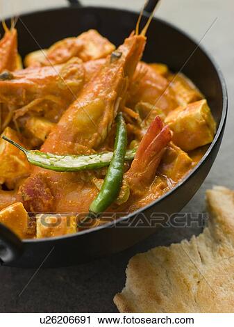 Stock Image - Chilli Tiger Prawns and Paneer Cheese. Fotosearch