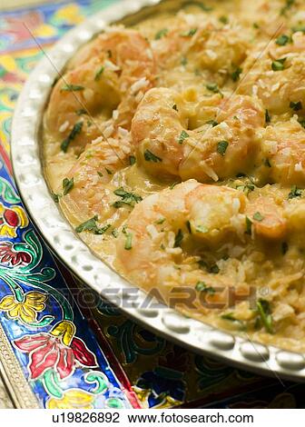 Stock Image - Dish of King Prawn Pasanda. Fotosearch