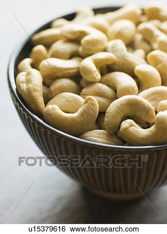 Stock Photograph - Dish of Roasted Cashew Nuts. Fotosearch