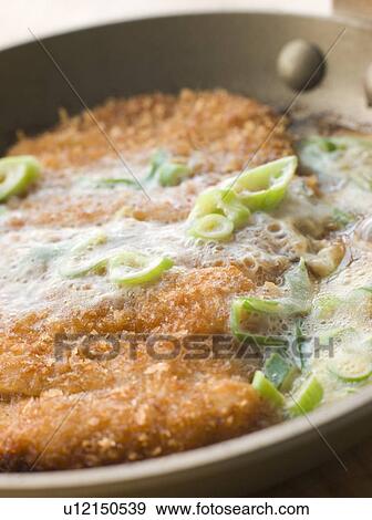 Stock Photo - Katsu-Doncooking in A Japanese Frying Pan. Fotosearch