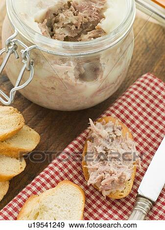 Stock Photo - Rilette of Duck and Pork with Toasted Baguette Croutes. Fotosearch