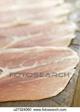Stock Image - Slices of Serano Ham. Fotosearch