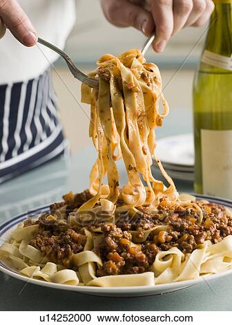 Tagaliatelle with Ragu Sauce View Large Photo Image Stock Image - Tagaliatelle with Ragu Sauce. Fotosearch