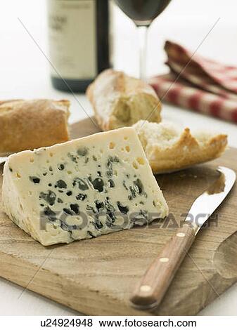 Stock Photo - Wedge of Roquefort Cheese with Rustic Baguette and Red Wine. Fotosearch