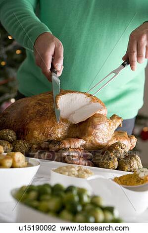 Carving Christmas Roast Turkey with all the Trimmings View Large Photo Image Stock Image - Carving Christmas Roast Turkey with all the Trimmings. Fotosearch