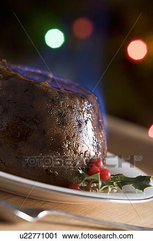 Stock Image - Christmas Pudding with a Brandy Flamb . Fotosearch
