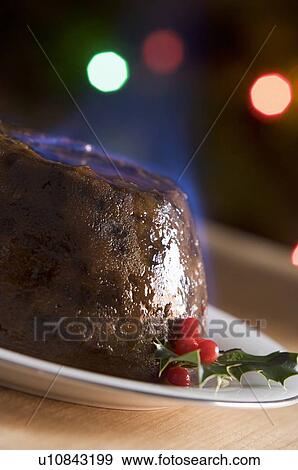 Stock Photo - Christmas Pudding with a Brandy Flamb . Fotosearch