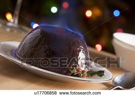 Christmas Pudding with a Brandy Flambe View Large Photo Image Stock Photo - Christmas Pudding with a Brandy Flambe . Fotosearch