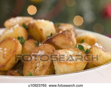 Stock Photography - Dish of Roast Potatoes with Sea Salt and Lemon Thyme. Fotosearch
