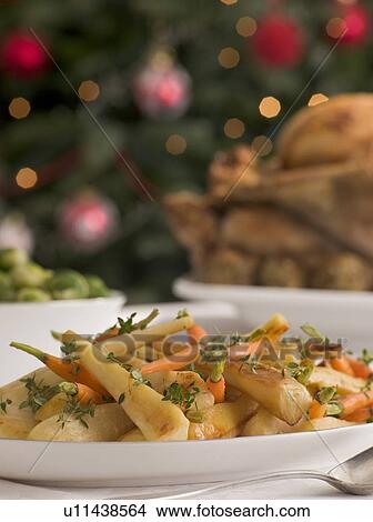 Honey and Thyme Roasted Parsnips and Baby Carrots View Large Photo Image Picture - Honey and Thyme Roasted Parsnips and Baby Carrots. Fotosearch