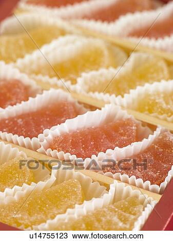 Stock Image - Jellied fruits in paper cases. Fotosearch