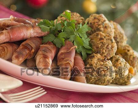 Plate of Pigs in Blankets and Chestnut Stuffing Balls View Large Photo Image Stock Photo - Plate of Pigs in Blankets and Chestnut Stuffing Balls. Fotosearch