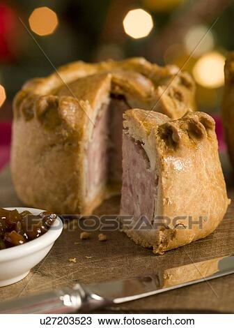 Pork Pie cut on a Board with Chutney View Large Photo Image Stock Image - Pork Pie cut on a Board with Chutney. Fotosearch