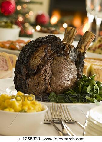 Stock Image - Rib of British Beef Boxing Day Buffet. Fotosearch
