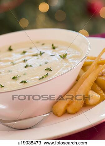 Stock Image - Roasted Parsnip and Thyme Soup. Fotosearch