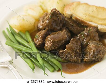 Beef Carbonnade with a Mustard Crouton and Green Beans View Large Photo Image Stock Image - Beef Carbonnade with a Mustard Crouton and Green Beans. Fotosearch