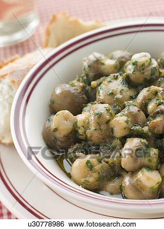 Bowl of Garlic Mushrooms with Rustic Bread View Large Photo Image Stock Photograph - Bowl of Garlic Mushrooms with Rustic Bread. Fotosearch