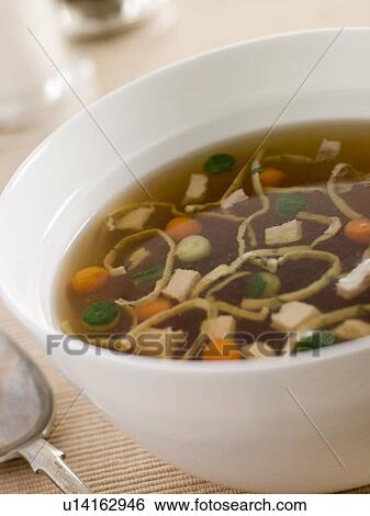 Chicken Consomm with Vegetable Pearls and Julienne of Pancake View Large Photo Image Stock Photograph - Chicken Consomm with Vegetable Pearls and Julienne of Pancake. Fotosearch