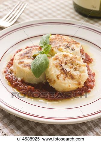 Stock Photography - Gnocchi Romana with Tomato Sauce. Fotosearch