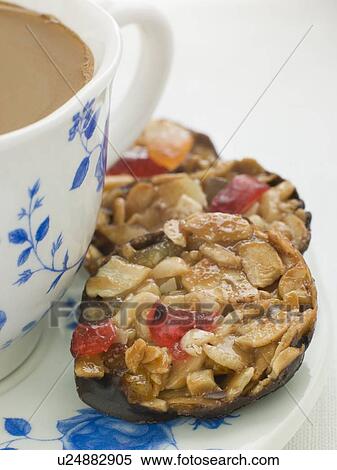 Stock Photography - Petit Florentines with a Cup of Tea. Fotosearch