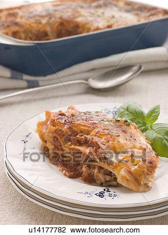 Stock Image - Portion of Lasagne with Basil. Fotosearch