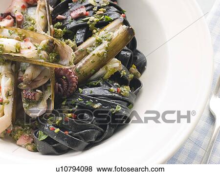 Sauteed Razor Clams with Baby Octopus Pesto and Tagliatelle Nero View Large Photo Image Stock Photo - Sauteed Razor Clams with Baby Octopus Pesto and Tagliatelle Nero. Fotosearch