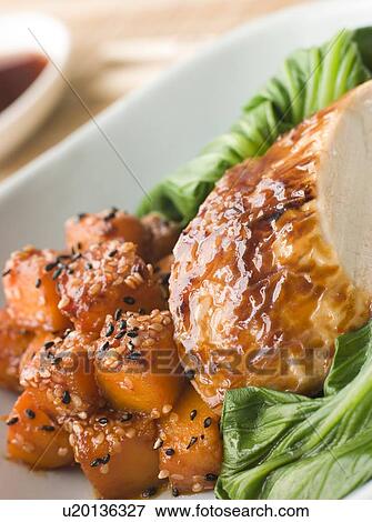 Stock Photo - Soy Roasted Chicken on Steamed Pac Choi with Teriyaki Roasted butternut Squash. Fotosearch