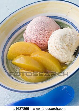Stock Image - Bowl of Peaches and Ice Cream. Fotosearch