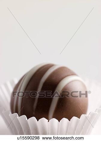 Stock Photo - Chocolate Truffle in a Petit four Case. Fotosearch