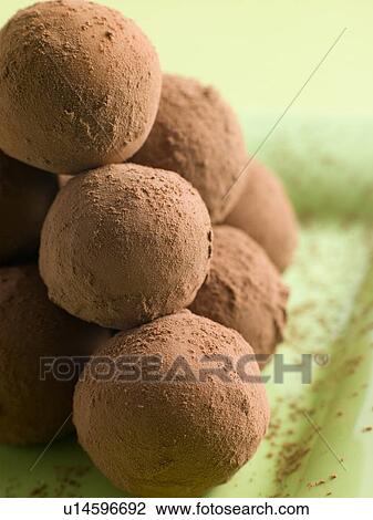 Stock Image - Chocolate Truffles on a plate. Fotosearch