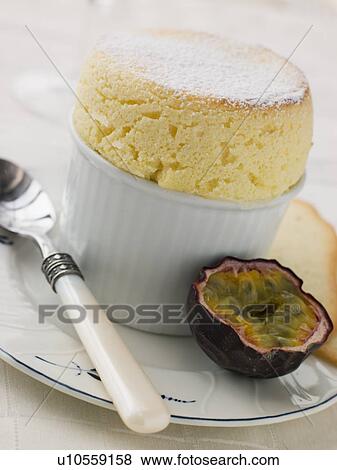 Hot Passion Fruit Souffle with Langue de Chat Biscuits View Large Photo Image Stock Photo - Hot Passion Fruit Souffle with Langue de Chat Biscuits. Fotosearch