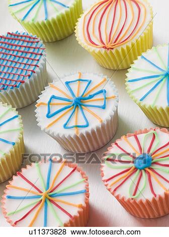 Stock Photo - Kaliedoscope Cup Cakes. Fotosearch
