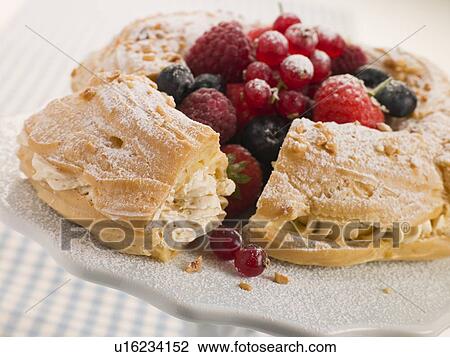 Stock Image - Paris Brest with Mixed Berries and Hazelnuts. Fotosearch