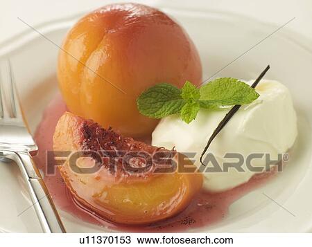 Stock Image - Peaches Poached in Sauternes with Creme Chantilly. Fotosearch